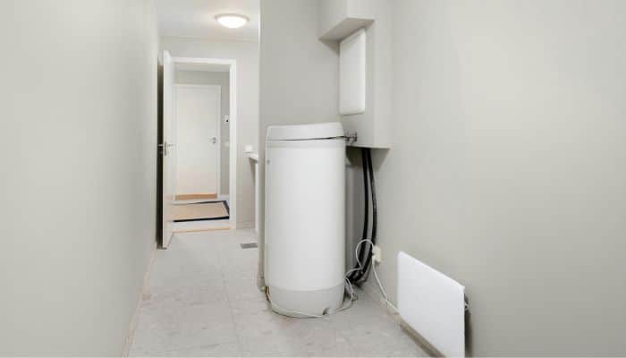 Old water heater being replaced with a new energy-efficient model